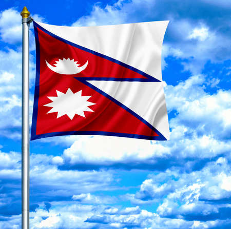 Nepal waving flag against blue skyの写真素材