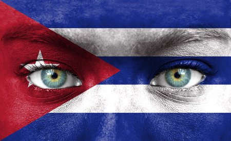 Human face painted with flag of Cubaの写真素材