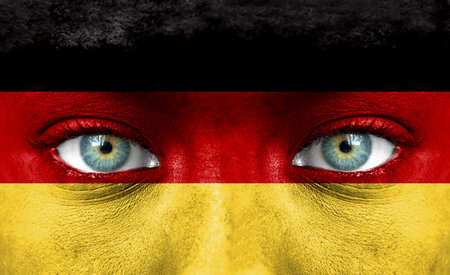 Human face painted with flag of Germanyの写真素材