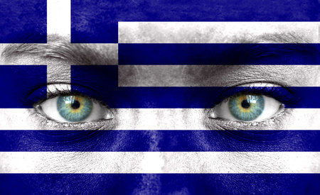 Human face painted with flag of Greeceの写真素材