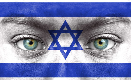 Human face painted with flag of Israelの写真素材