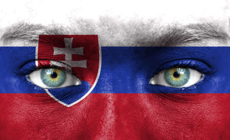 Human face painted with flag of Slovakiaの写真素材