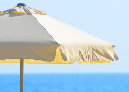 Beach umbrella against the sea and skyの写真素材