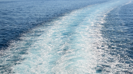 Cruise ship trails in open seaの写真素材