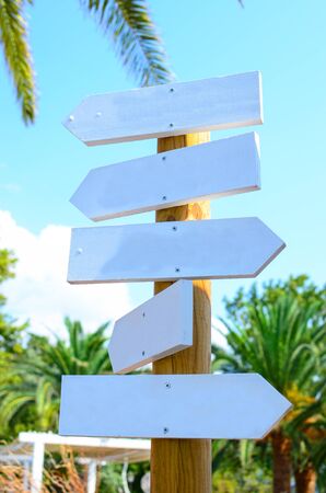 Empty arrow woode signs at beachの写真素材