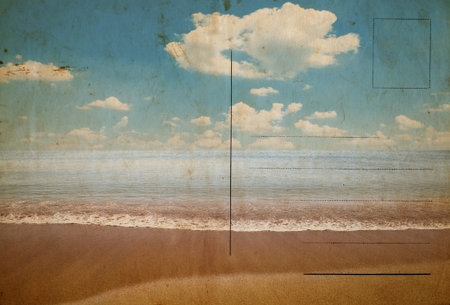 Reverse side of an old stained postcard with image of sandy tropical beachの写真素材