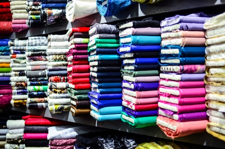 Various textile materials on shelvesの写真素材