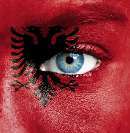 Human face painted with flag of Albaniaの写真素材