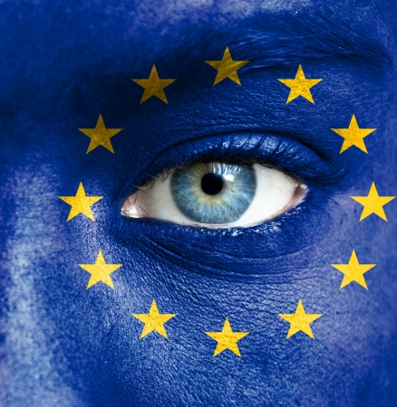 Human face painted with flag of European Union Human face painted with flag of European Union