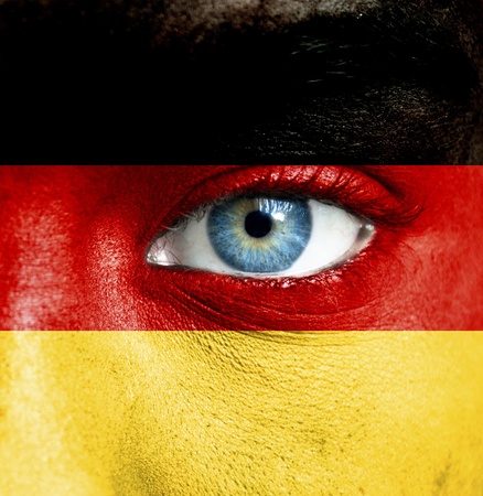 Human face painted with flag of Germanyの写真素材