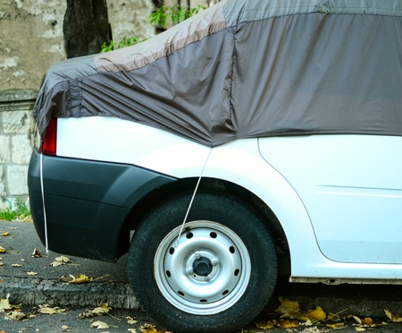 Car covered with protections sheet - Protect car conceptの写真素材