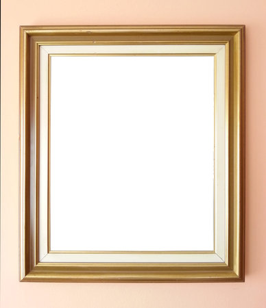 Empty golden frame on wallの写真素材