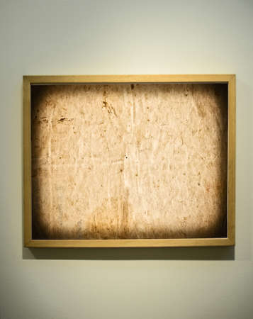 Empty picture frame on gallery wallの写真素材