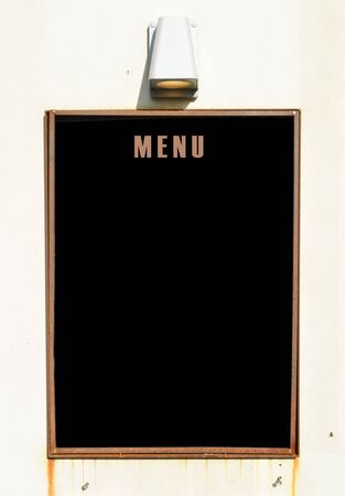 Empty menu board on wallの写真素材