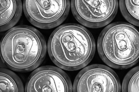 Abstract view of cold cans with refreshing drink background