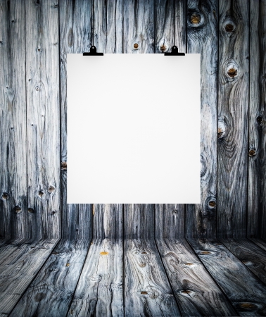 Interior of wooden empty room with white paper hanging on paper clipsの写真素材