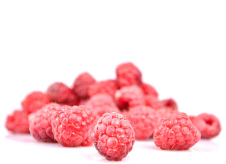 Group of fresh raspberries isolated on white 