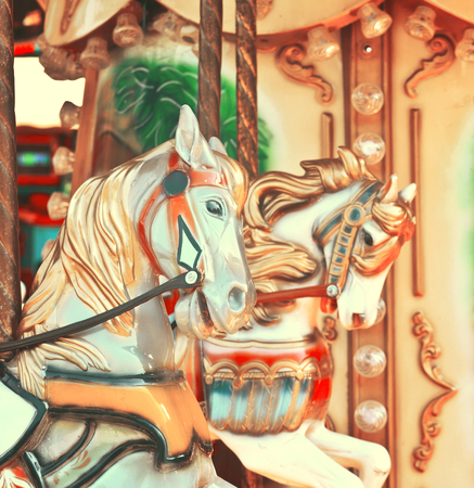 Carousel -  Fair conceptual background with horses in vintage tonesの写真素材