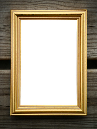 Empty golden picture frame on wooden wallの写真素材
