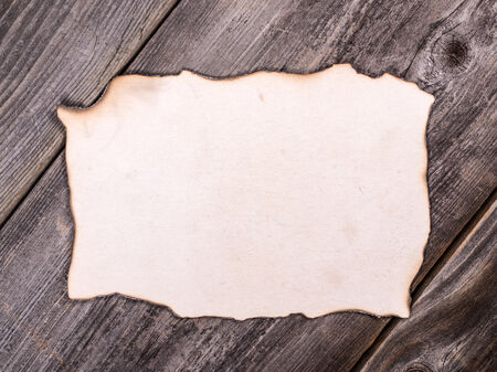 Old paper sheet over wooden backgroundの写真素材