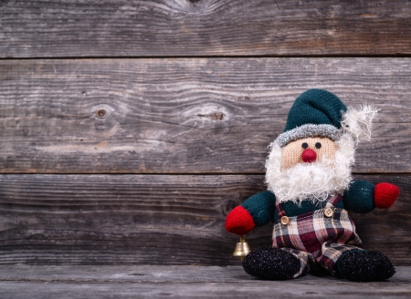 Santa Claus toy against wooden background - Christmas conceptの写真素材
