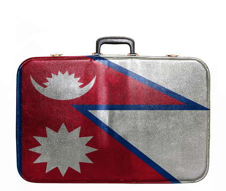 Vintage travel bag with flag of Nepalの写真素材