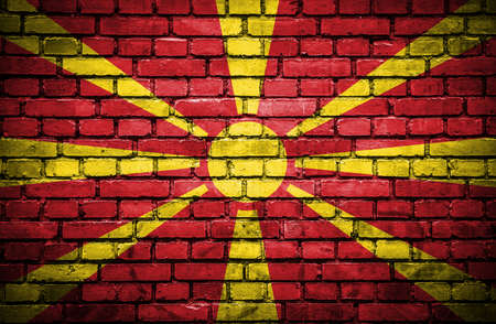 Brick wall with painted flag of Maceodoniaの写真素材