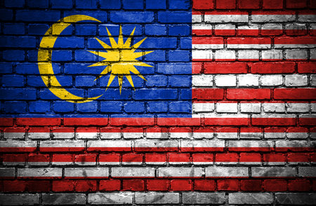 Brick wall with painted flag of Malaysiaの写真素材
