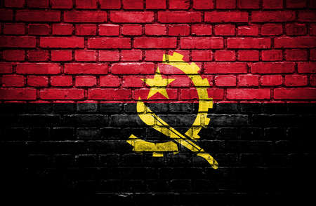 Brick wall with painted flag of Angolaの写真素材