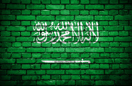Brick wall with painted flag of Saudi Arabiaの写真素材