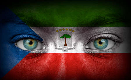 Human face painted with flag of Equatorial Guineaの写真素材