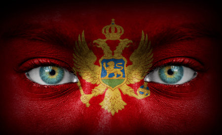Human face painted with flag of Montenegroの写真素材