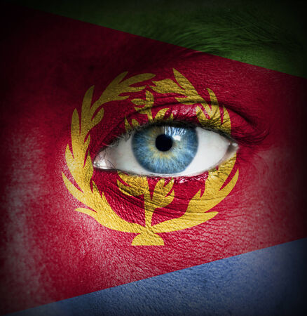 Human face painted with flag of Eritreaの写真素材