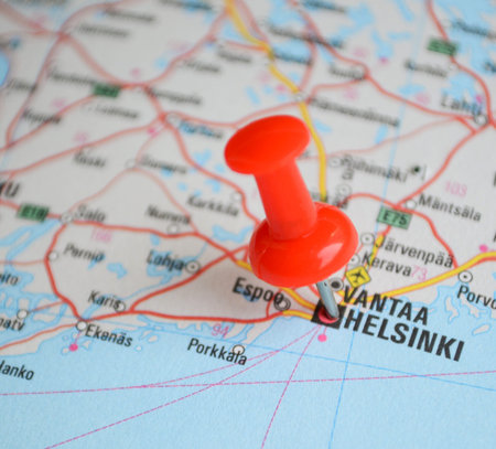 Close up of Helsinki map with red pin - Travel concept