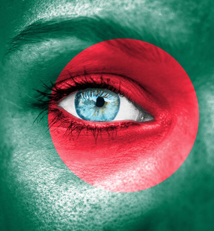 Woman face painted with flag of Bangladeshの写真素材