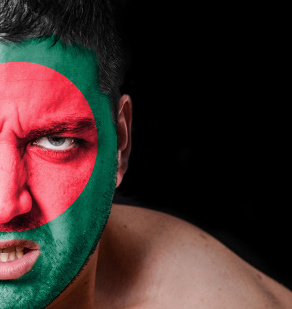 Portrait of angry man with painted flag of Bangladeshの写真素材