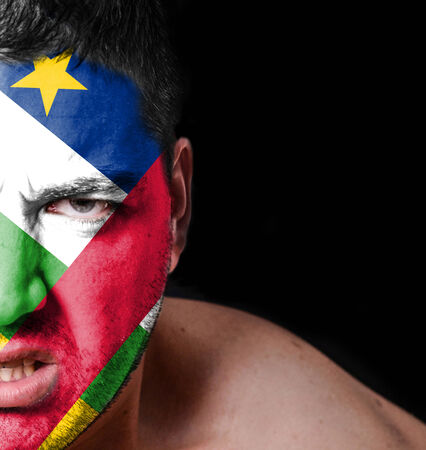 Portrait of angry man with painted flag of Central African Republicの写真素材