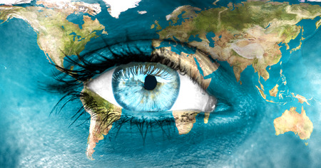 Planet earth and blue human eye - "Elements of this image furnished by NASA"の写真素材