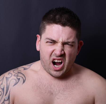 Angry man screamingの写真素材