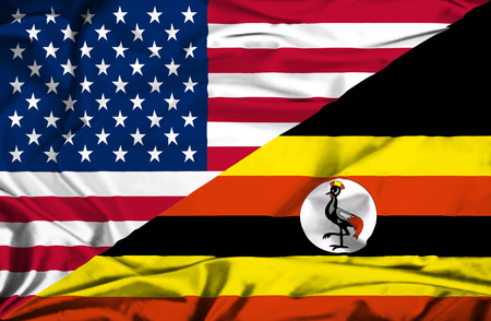 Waving flag of Uganda and USAの写真素材
