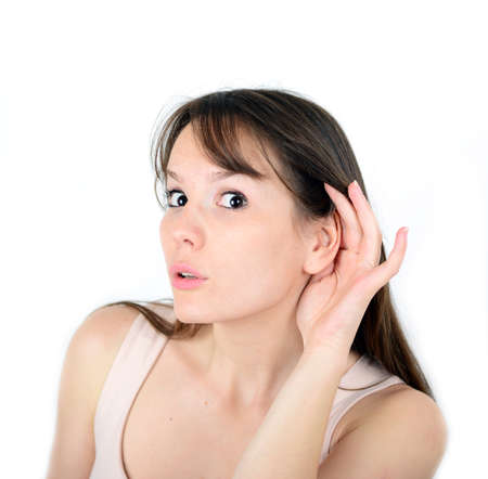 Beautiful female with listening gesture isolated over a white backgroundの写真素材