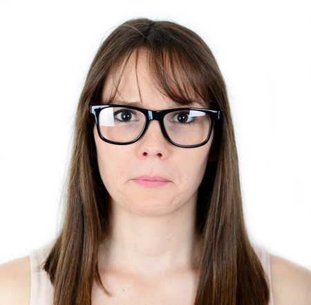 Portrait of sad young female isolated on white background