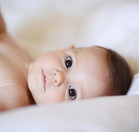 Beautiful baby girl looking at cameraの写真素材
