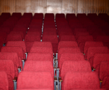 Empty red seats for cinema theater conference or concertの写真素材