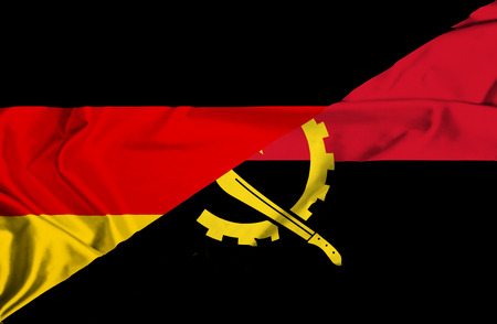 Waving flag of Angola and Germanyの写真素材