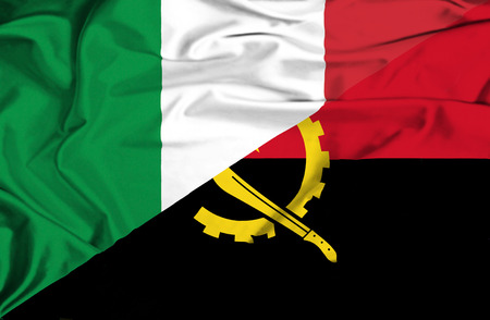 Waving flag of Angola and Italyの写真素材
