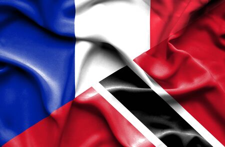 Waving flag of Trinidad and Tobago and Franceの写真素材