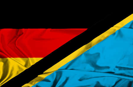 Waving flag of Tanzania and Germanyの写真素材