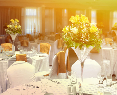 Flower arrangment on wedding tablesの写真素材