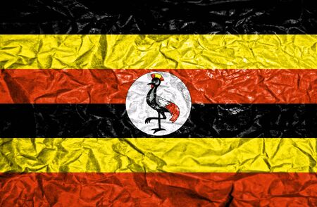 Uganda vintage flag on old crumpled paper backgroundの写真素材